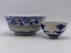 A CHINESE BLUE AND WHITE FLARED FORM FOOTED BOWL WITH DRAGON AND PHOENIX DECORATION, SIX CHARACTER