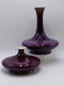 TWO CHINESE VASES OF COMPRESSED BALUSTER FORM WITH STREAKY SANG DE BOUEF GLAZE AND UNDERFOOT