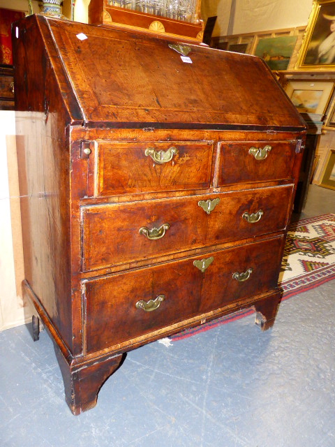 A GEORGIAN AND LATER INLAID WALNUT SMALL SLANT TOP BUREAU WITH FITTED INTERIOR ABOVE TWO SHORT AND