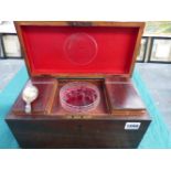 AN EARLY 19TH.C.MAHOGANY TEA CADDY WITH FITTED INTERIOR, GLASS MIXING BOWL AND A HALLMARKED SILVER