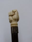 A 19TH CENTURY ENGLISH OR EUROPEAN IVORY TOP WALKING CANE WITH HANDLE FINELY CARVED IN THE FORM OF