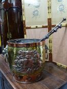 AN ANTIQUE BRASS AND COPPER COAL BUCKET WITH ARMORIAL CRESTS AND LION MASK HANDLES AND A SET OF