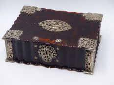 A FLUTED TORTOISE SHELL LIDDED BOX WITH WHITE METAL STYLIZED BIRDS AND A FLORAL DESIGN IN THE