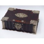 A FLUTED TORTOISE SHELL LIDDED BOX WITH WHITE METAL STYLIZED BIRDS AND A FLORAL DESIGN IN THE