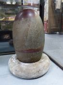 A LARGE INDIAN SHIVA LINGAM STONE OF RICH SOFT GREY COLOUR WITH RED INCLUSION TO TOP AND RED LINE