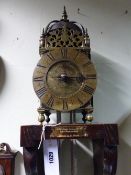 A RARE EARLY 18TH.C.LANTERN CLOCK BY EDWARD HEMMINS, BICESTER, C.1730 ON A LATER OAK WALL BRACKET