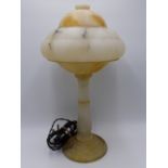 AN ART DECO ALABASTER TABLE LAMP AND SHADE WITH BAULSTER COLUMN.
