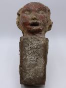 AN INTERESTING EARLY EASTERN EFFIGY KEYSTONE WITH REMNANTS OF PAINTED DECORATION - POSSIBLY