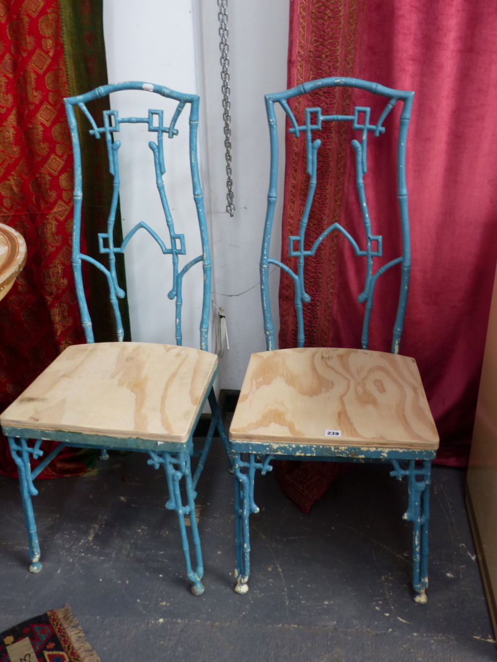 A SET OF FOUR ALUMINIUM HIGH BACK CHAIRS IN THE CHINOISERIE AESTHETIC TASTE.