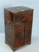 A BRASS BOUND EARLY 19TH CENTURY MAHOGANY PRESENTATION CABINET, LIFT TOP ABOVE TWO DOORS WITH