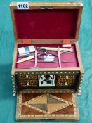 A SMALL EASTERN INLAID SEWING BOX WITH FALL FRONT.