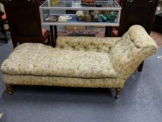 A VICTORIAN BUTTON UPHOLSTERED CHAISE LONGUE.