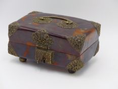 A FOOTED TORTOISE SHELL HINGED BOX WITH WHITE METAL BOUND CORNERS. MATCHING FLORAL HINGED HASP AND