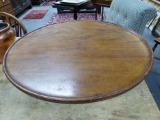 A VICTORIAN CARVED MAHOGANY DISH TOP LAZY SUSAN. 53CMS DIAMETER.