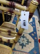 A SET OF SIX UNUSUAL VICTORIAN HIGH BACK FAUX BAMBOO CHAIRS WITH PAINTED DECORATION AND CANE SEATS.