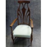 AN EDWARDIAN MAHOGANY ART NOUVEAU DESIGN HIGHBACK ARMCHAIR.