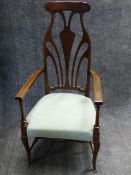 AN EDWARDIAN MAHOGANY ART NOUVEAU DESIGN HIGHBACK ARMCHAIR.