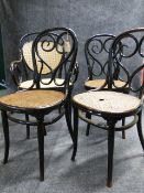 THREE VINTAGE THONET BENTWOOD CAFE CHAIRS WITH CANE SEATS AND A SIMILAR CANE SEAT AND BACK ARMCHAIR,