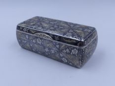 A RUSSIAN SILVER NIELLO WORK HINGED AND ROUNDED RECTANGULAR BOX WITH .84 STANDARD AND TOWN MARK