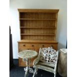 A VICTORIAN AND LATER COUNTRY PINE TWO PART DRESSER, PLATE RACK ABOVE A TWO DOOR BASE WITH FOUR