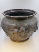 AN ANTIQUE JAPANESE LARGE BRONZE JARDINIERE WITH WRITHING DRAGON DECORATION. H.32cms.