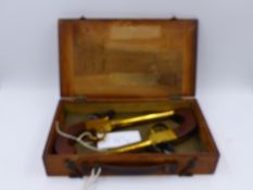 A PAIR OF BRASS BARRELLED AND FRAMED FLINTLOCK PISTOLS IN WOODEN BOX.