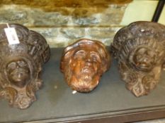 A PAIR OF EARLY CARVED OAK BRACKETS OR CORBELS WITH PORTRAIT MASK SUPPORTS AND A PORTRAIT APPLIQUE