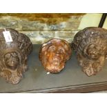 A PAIR OF EARLY CARVED OAK BRACKETS OR CORBELS WITH PORTRAIT MASK SUPPORTS AND A PORTRAIT APPLIQUE