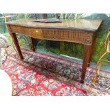 AN EDWARDIAN CARVED MAHOGANY GEO. lll STYLE TWO DRAWER SERPENTINE SIDE TABLE WITH FLUTED APRON,