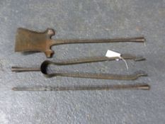 A SET OF THREE WROUGHT IRON PLANISHED ARTS AND CRAFTS FIRE TOOLS.
