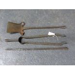 A SET OF THREE WROUGHT IRON PLANISHED ARTS AND CRAFTS FIRE TOOLS.