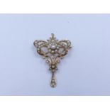 AN EARLY EDWARDIAN SEED PEARL BROOCH WITH ADDITIONAL PENDANT FITTING STAMPED 9ct GOLD.