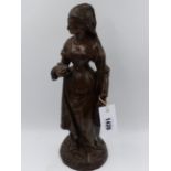 AN ANTIQUE BRONZE FIGURE OF A TUDOR LADY CARRYING A BOOK. H.38cms.