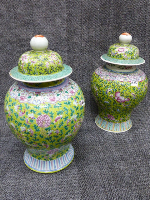 TWO SIMILAR CHINESE FAMILLE ROSE BALUSTER VASES WITH A PAIR OF ASSOCIATED DOME FORM COVERS.