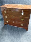 A GEORGIAN BOWFRONT CHEST WITH INLAY AND CROSSBANDING, BRUSHING SLIDE AND THREE LONG DRAWERS ON