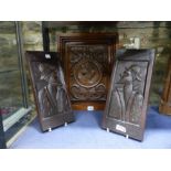 THREE ANTIQUE CARVED OAK PORTRAIT PANELS, A PAIR WITH PROFILES AND A LARGER EXAMPLE WITH CENTRAL