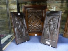 THREE ANTIQUE CARVED OAK PORTRAIT PANELS, A PAIR WITH PROFILES AND A LARGER EXAMPLE WITH CENTRAL