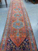 AN ANTIQUE PERSIAN HAMADAN RUNNER. 477 x 107cms.