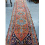 AN ANTIQUE PERSIAN HAMADAN RUNNER. 477 x 107cms.