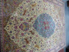 AN ANTIQUE PERSIAN CARPET OF CLASSICAL ANIMAL DESIGN. 405 x 295cms.