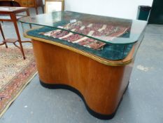 A PAIR OF VINTAGE FLAT TOP GLAZED SHOP DISPLAY CABINETS OF SHAPED FORM WITH MULTI DRAWER PEDESTALS