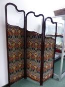 AN ART NOUVEAU EARLY 20th.C. CARVED MAHOGANY THREE FOLD DRESSING SCREEN WITH GLAZED PANELS ABOVE