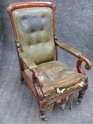 A CARVED MAHOGANY GENTLEMAN'S EARLY VICTORIAN LIBRARY ARMCHAIR IN GREEN LEATHER WITH BUTTONED BACK