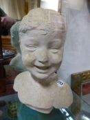 AN EARLY 20th.C. STUCCO PORTRAIT BUST OF A CHILD. H.34cms.