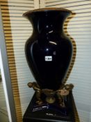 A LARGE ART DECO DESIGN BRONZE MOUNTED BALUSTER VASE WITH FIGURAL SUPPORTS. H.58cms.