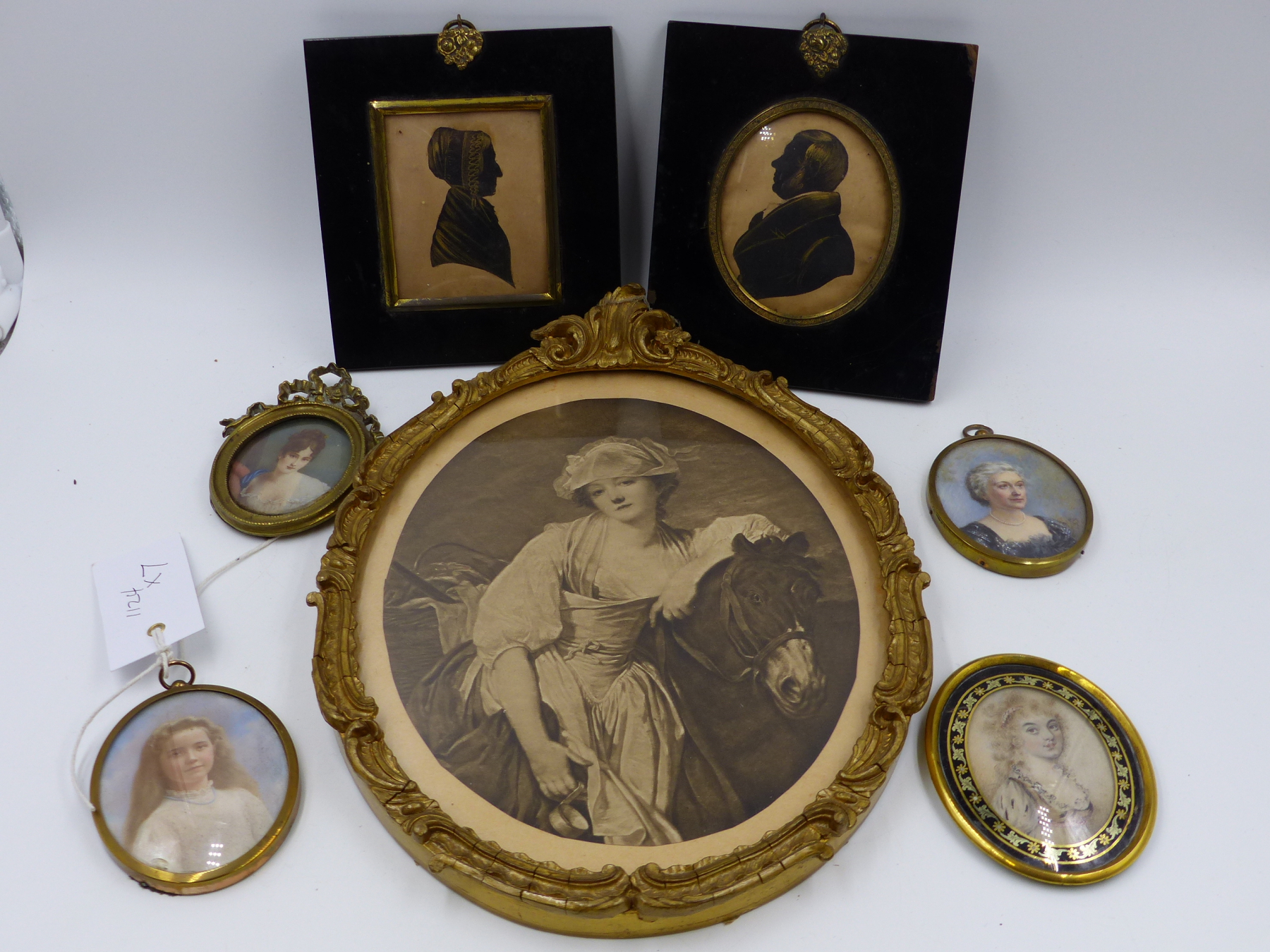 A COLLECTIVE LOT OF MINIATURES TO INCLUDE TWO SILHOUETTES, THREE OVAL WATERCOLOUR PORTRAITS , SOME