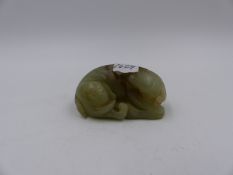 A CHINESE CARVED JADE FIGURE OF A RECUMBENT ELEPHANT. L.7cms.