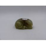 A CHINESE CARVED JADE FIGURE OF A RECUMBENT ELEPHANT. L.7cms.