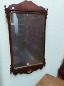 A GEORGIAN MAHOGANY MIRROR OF LARGE SIZE WITH CARVED GILT SLIP AND SHELL DECORATED APRON. H.102cms.