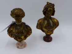 A PAIR OF GILT AND PATINATED BRONZE PORTRAIT BUSTS ON MARBLE SOCLES SIGNED ILLEGIBLY. H.OVERALL 16.